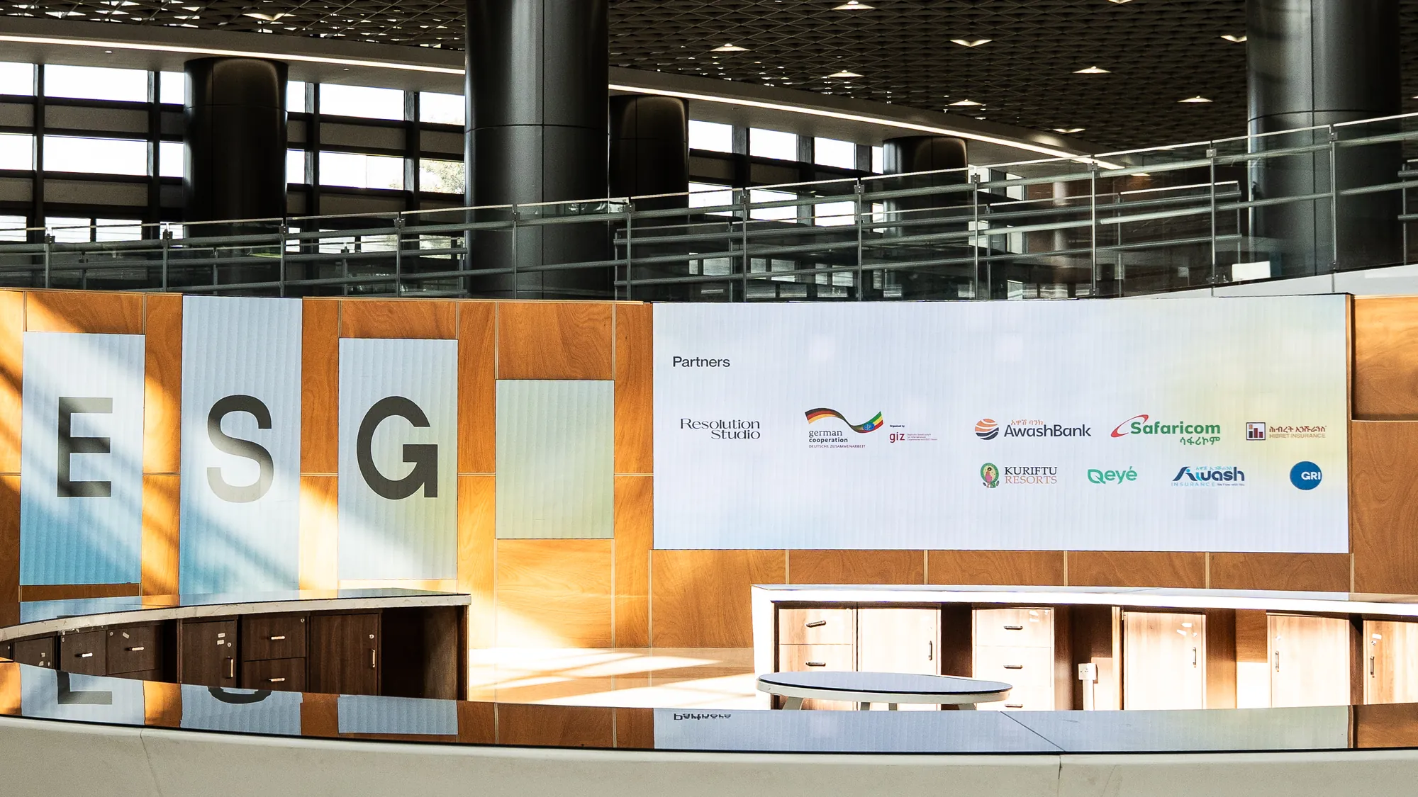 The forum entrance: tall E, S and G panels beside the partners board.