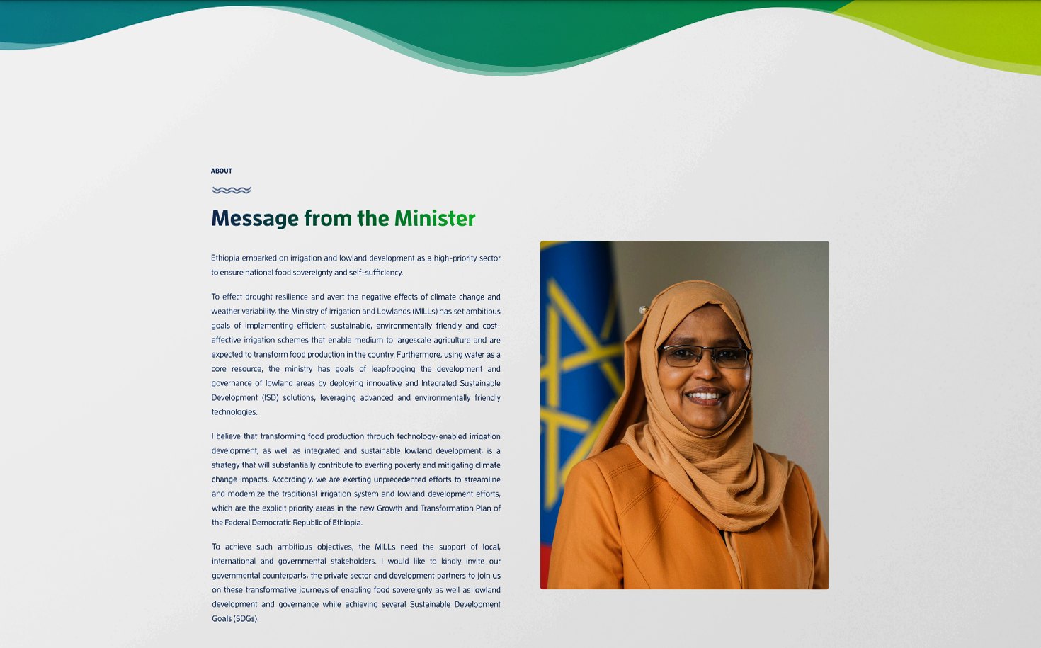 The delivered About page design: a wave header above the Message from the Minister beside a portrait.