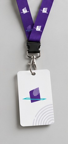 A purple lanyard printed with the symbol, holding a white ID card.