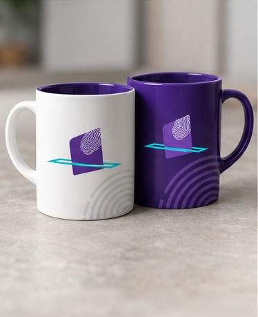 A white mug and a purple mug with the NEBE symbol.